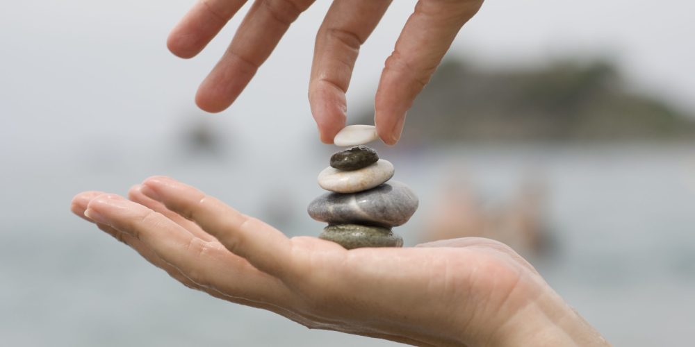 putting-last-pebble-pile-stones